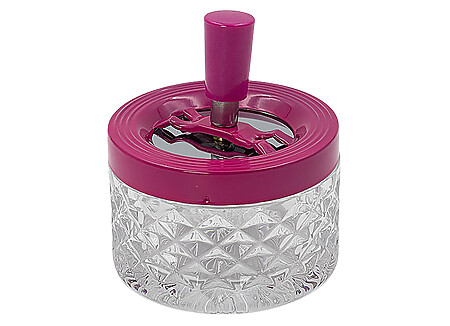 Round push-top ashtray in fuchsia glass and metal.